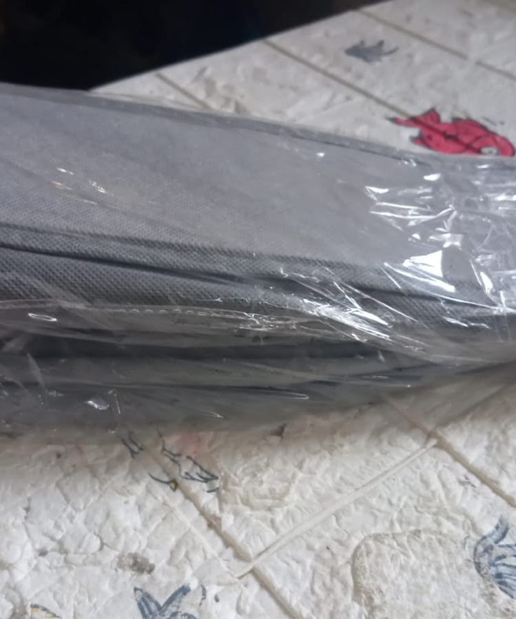 Removable tie and sock storage box for easy organization.