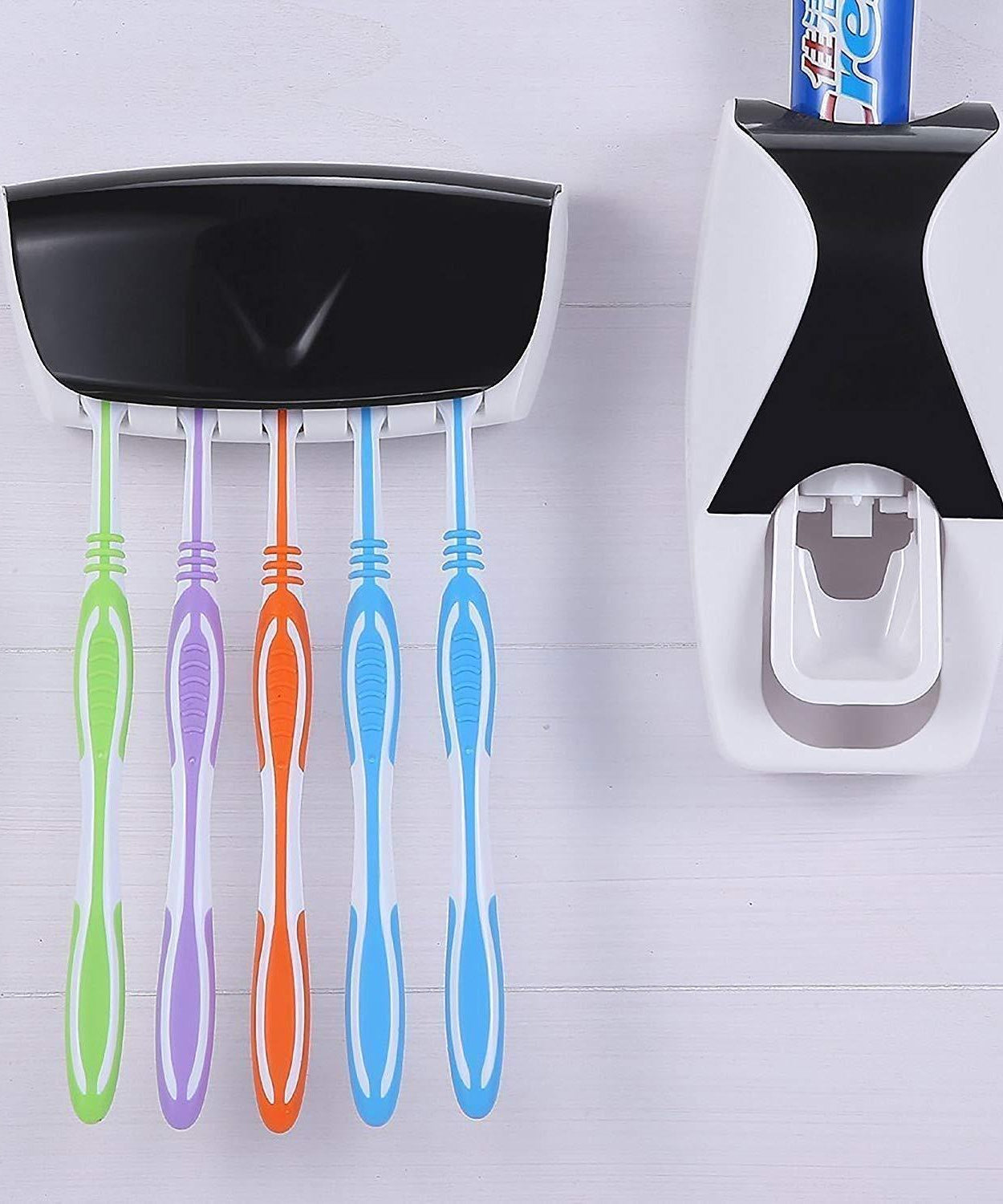 Toothpaste dispenser with toothbrush