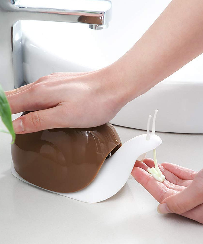 Portable soap dispenser in snail shape for easy handling and use.