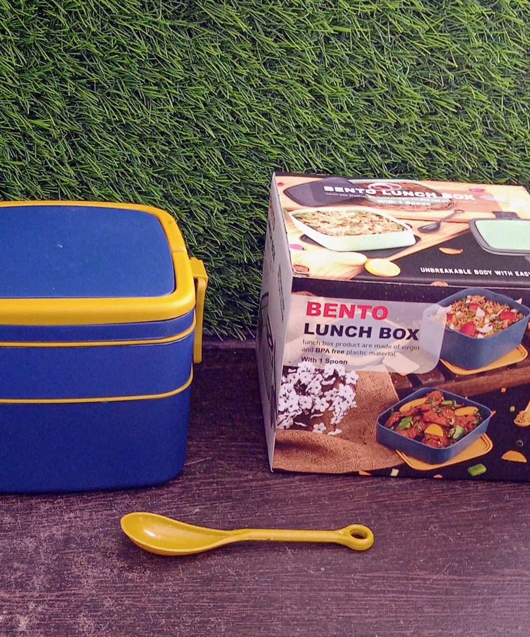 Blue portable lunch box with spoon and carrying handle