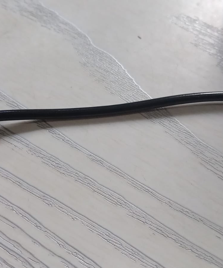 Micro USB cable for power bank connection.