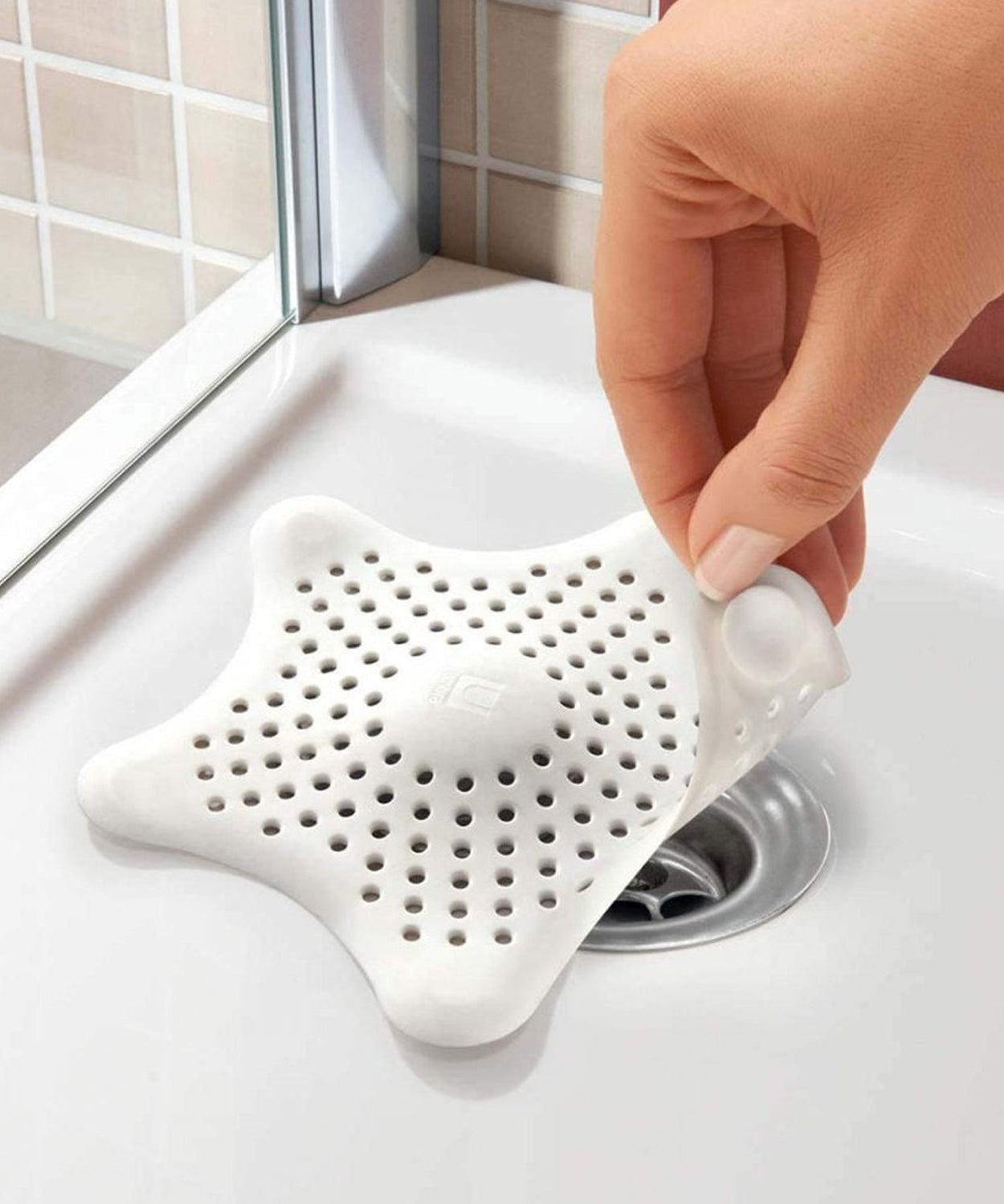 Star-shaped drain strainer to prevent clogs in pipes