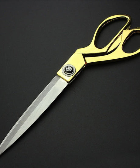 Premium cloth cutting scissors with gold finish.