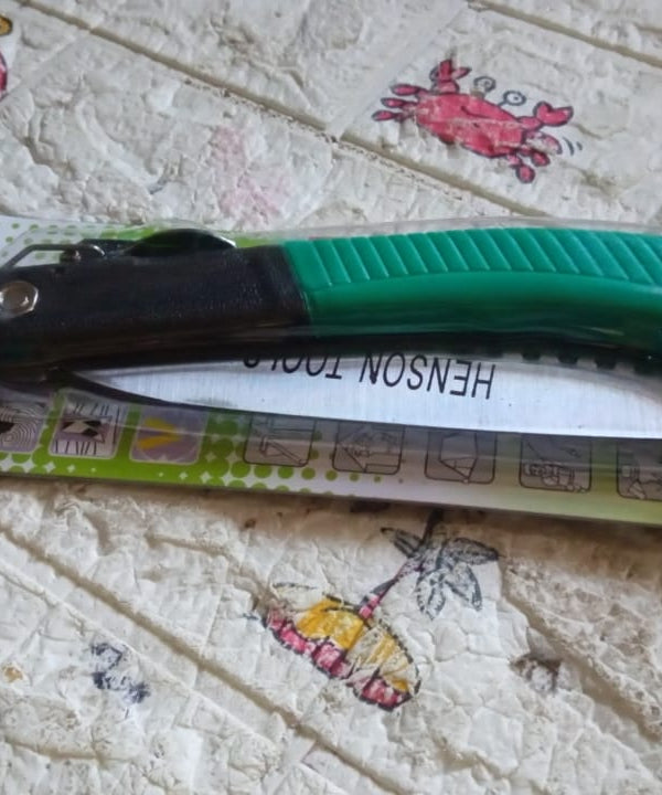 Folding saw for tree trimming and various cutting tasks, ideal for camping and gardening.