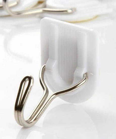 White plastic hook for hanging kitchen towels.