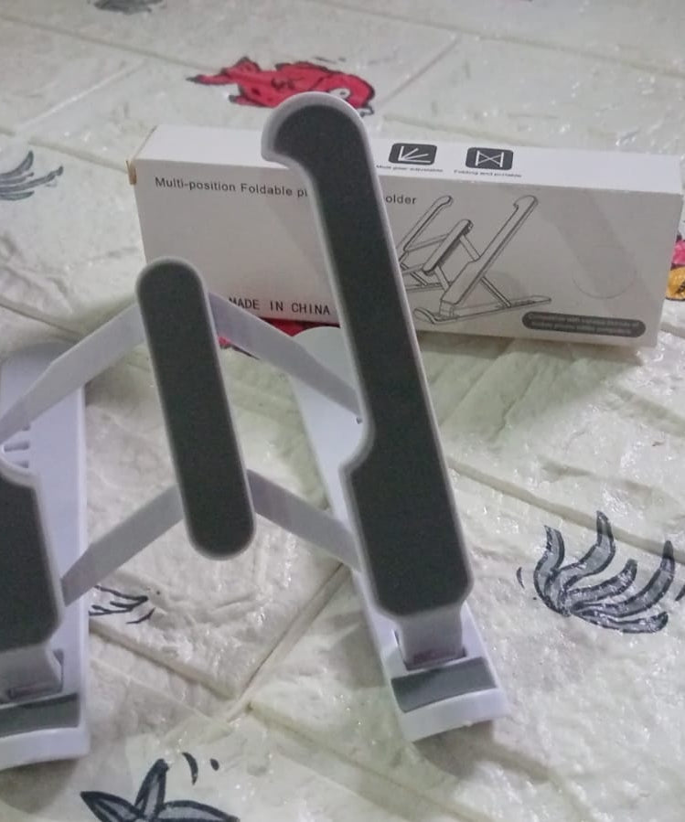 Adjustable stand for tablets with foldable legs