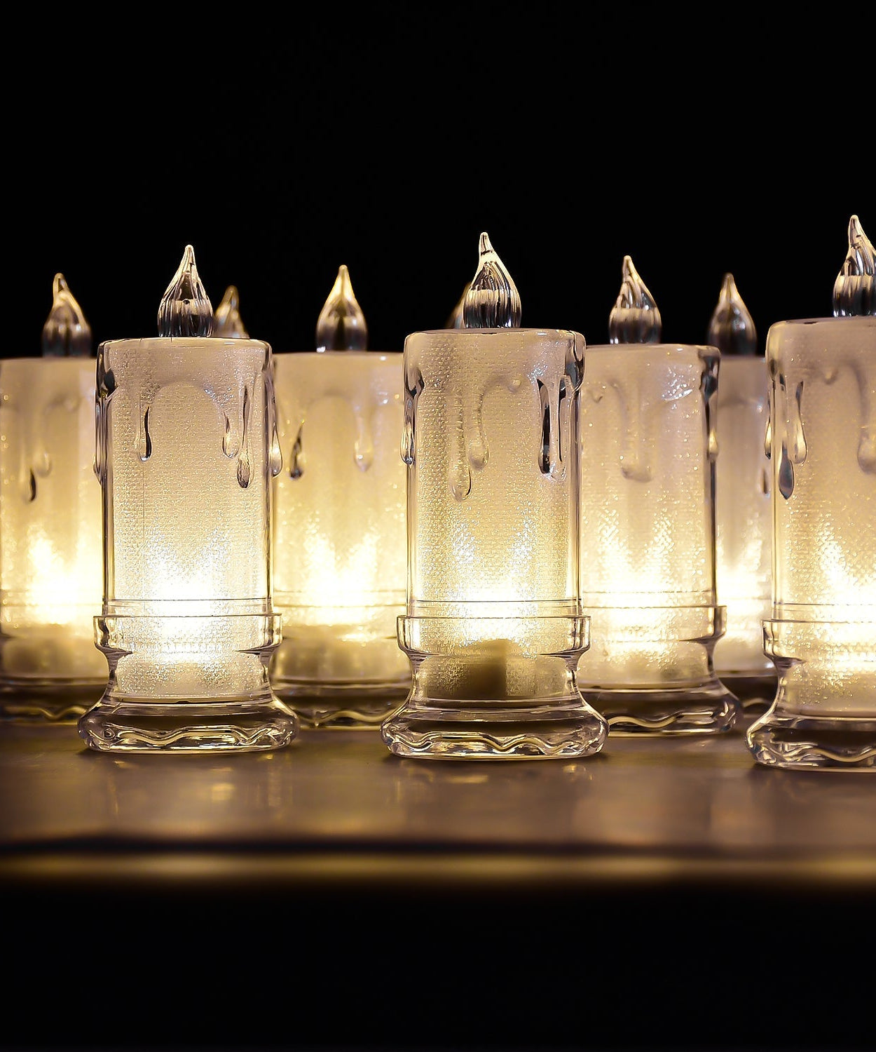 Group of melted design flameless candles.