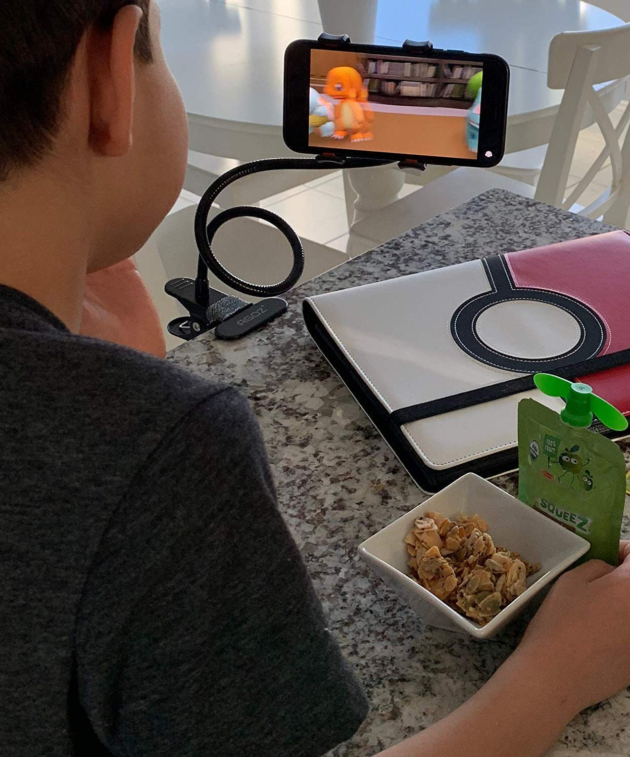 Foldable metal stand for phones, flexible use.