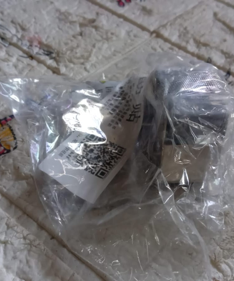 Wall-mounted stainless steel broom and mop holder with adhesive glue.