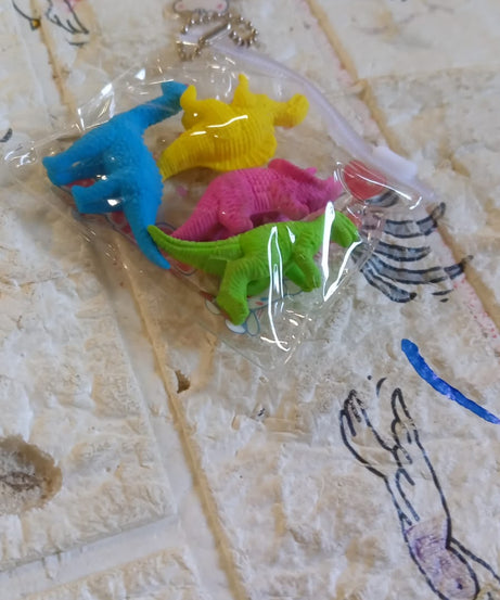 Set of dinosaur erasers for children’s school supplies