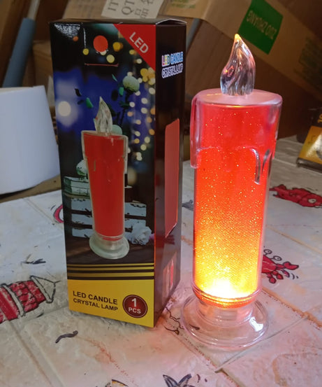 Close-up of the red LED candle, emphasizing its realistic and safe flame-like appearance.