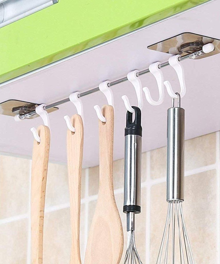 Adhesive hanger hooks, plastic, for organizing items securely.