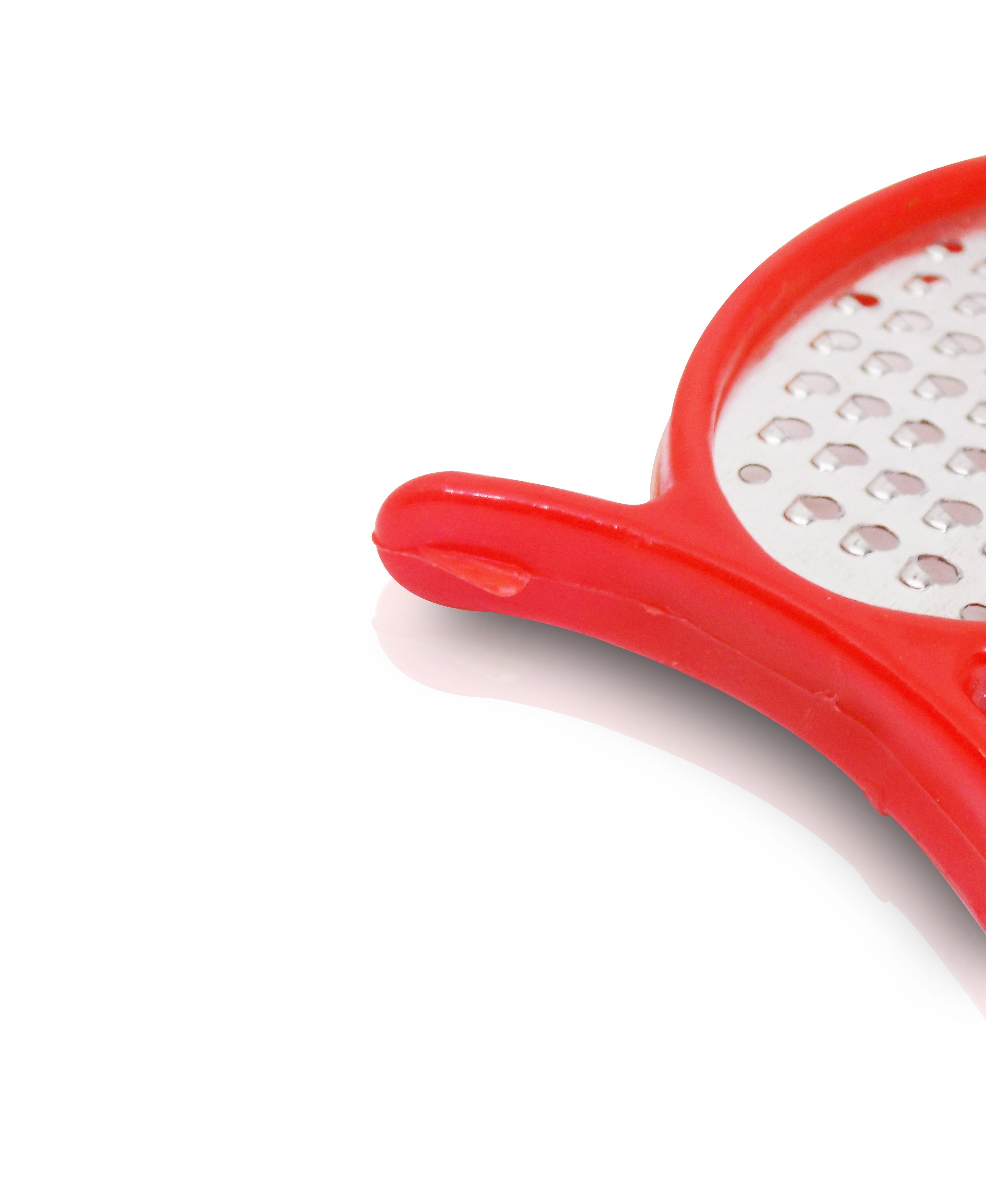 4-in-1 kitchen tool: peeler, slicer, grater, and cutter.