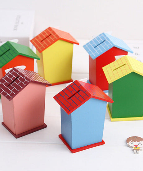 Cartoon piggy bank with house design