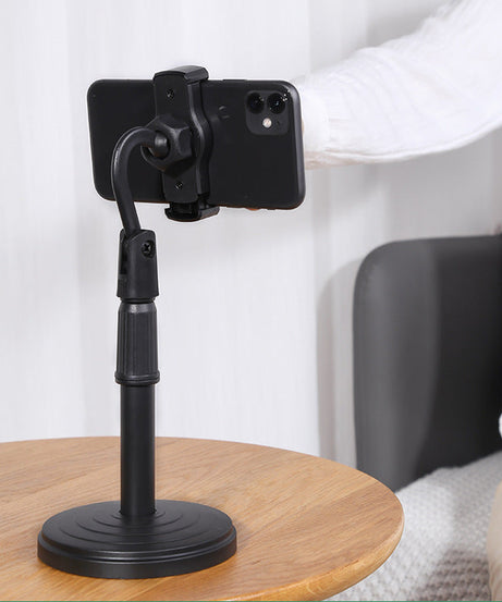 Desktop mobile stand, height adjustable, ideal for hands-free phone usage on tables.