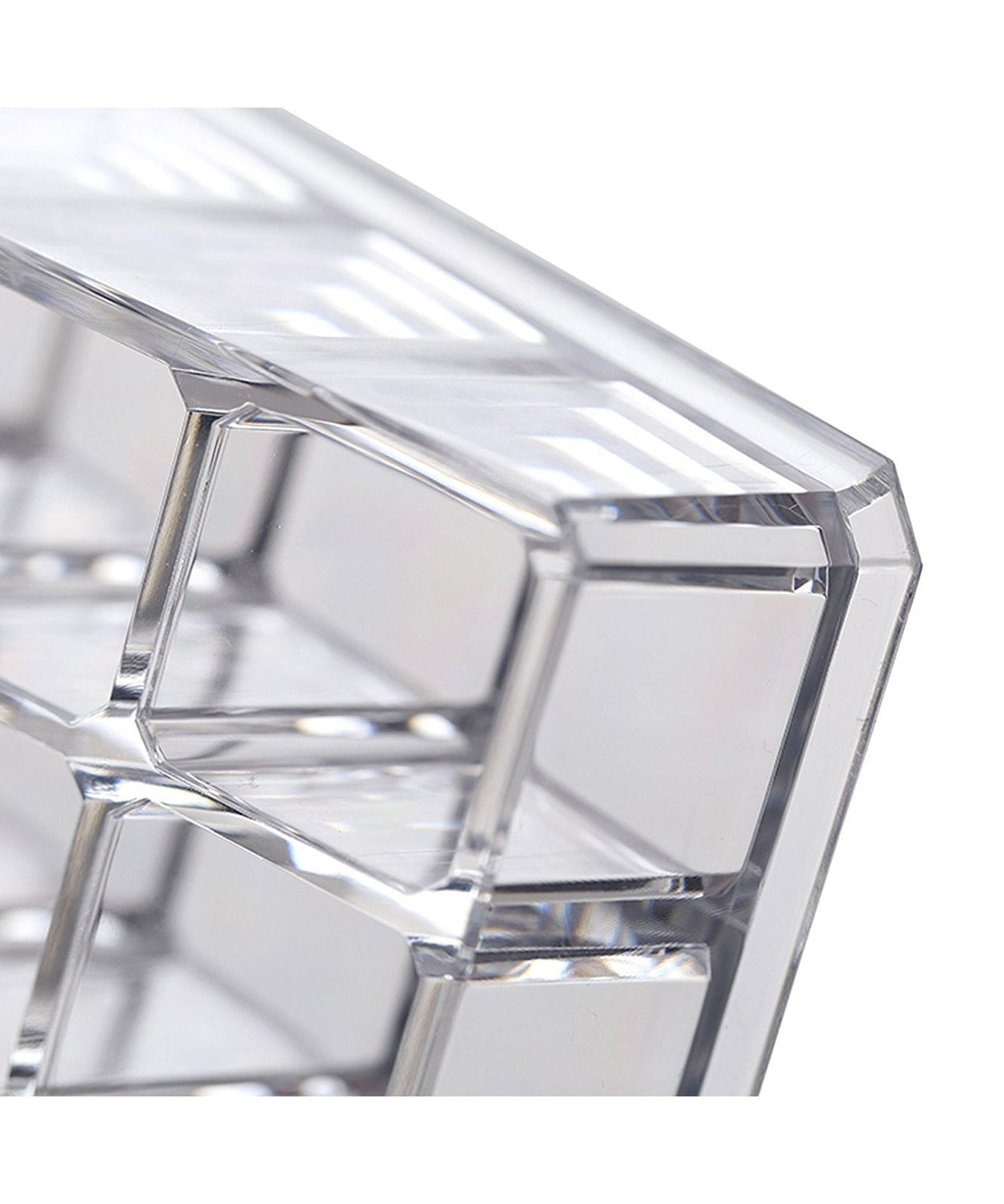 Clear acrylic display stand for cosmetics with 24 compartments, focusing on its practical use