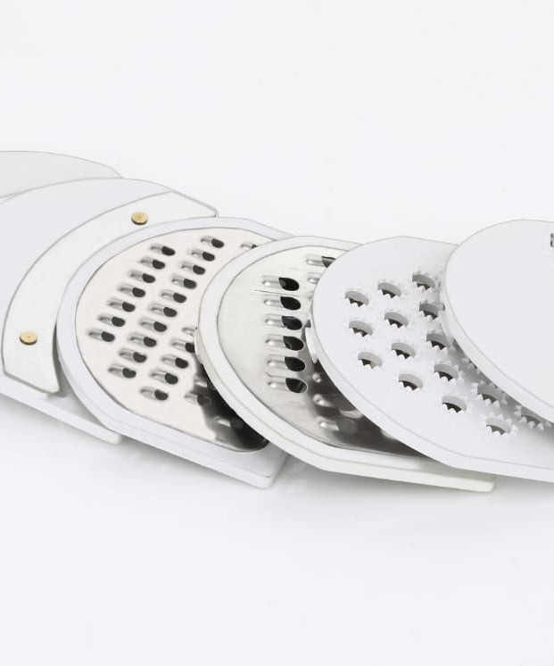 Versatile vegetable cutter and slicer with drain basket.