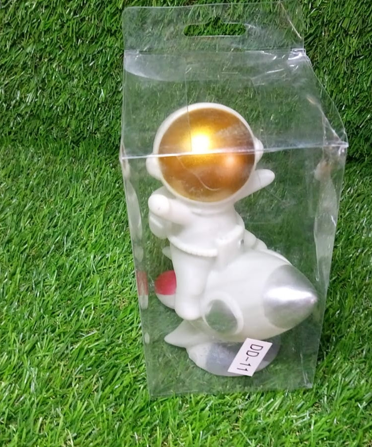 Decorative astronaut model for tabletop decor.