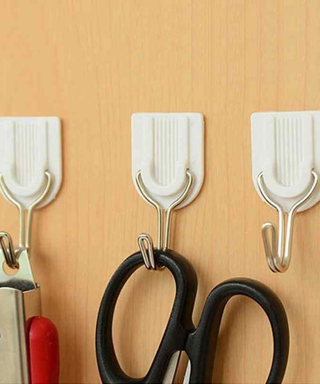 Wall hook for towels with adhesive backing.