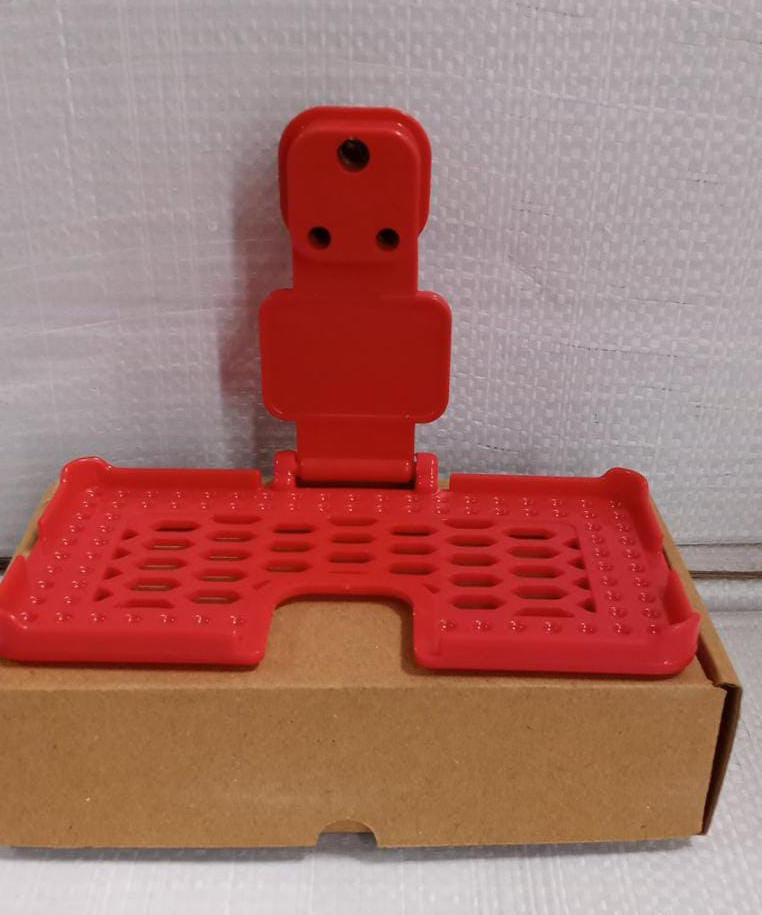 Multi-purpose wall holder in red.