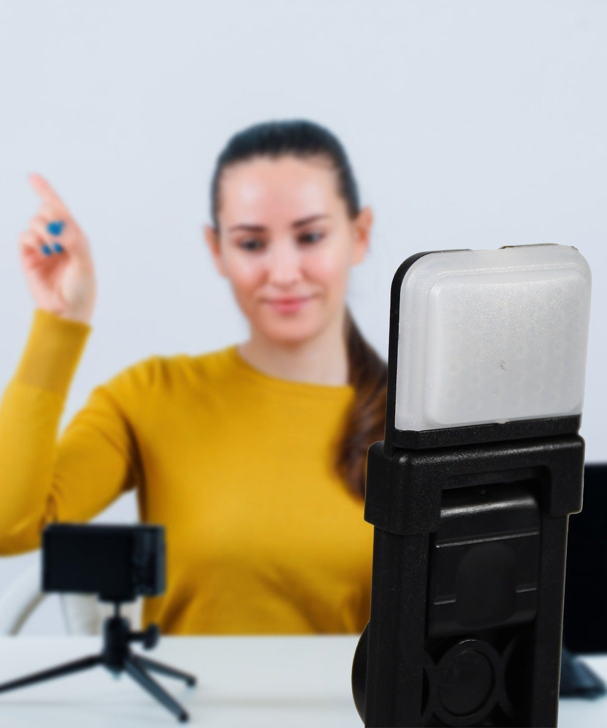Selfie stick with tripod legs and integrated Bluetooth remote control