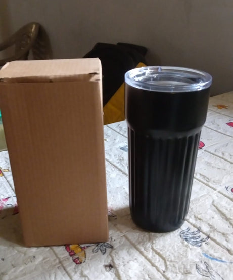 Stainless steel travel mug with lid, ideal for coffee and tea.