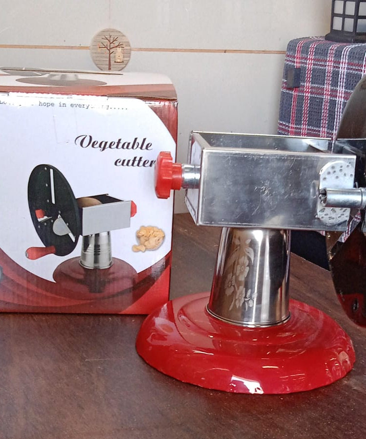 Stainless Steel Chips Maker and Vegetable Slicer for Kitchen Potato Slicer Graters and Chippers. Chips Maker is Suitable for Vegetable Cuttings. Chips Maker Consist Hard Coated Iron Wheel and Stand.