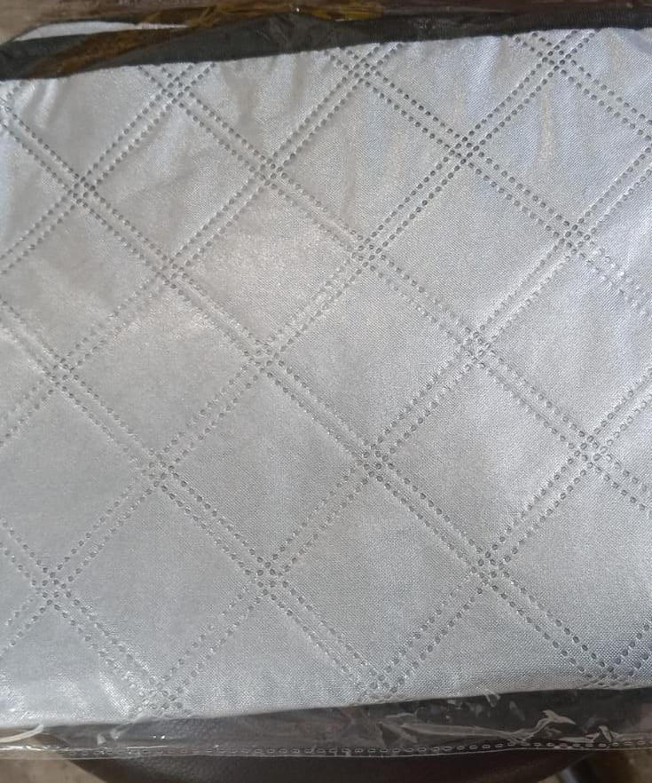 Aluminum foil cover for small air conditioners, protects from dust and weather.