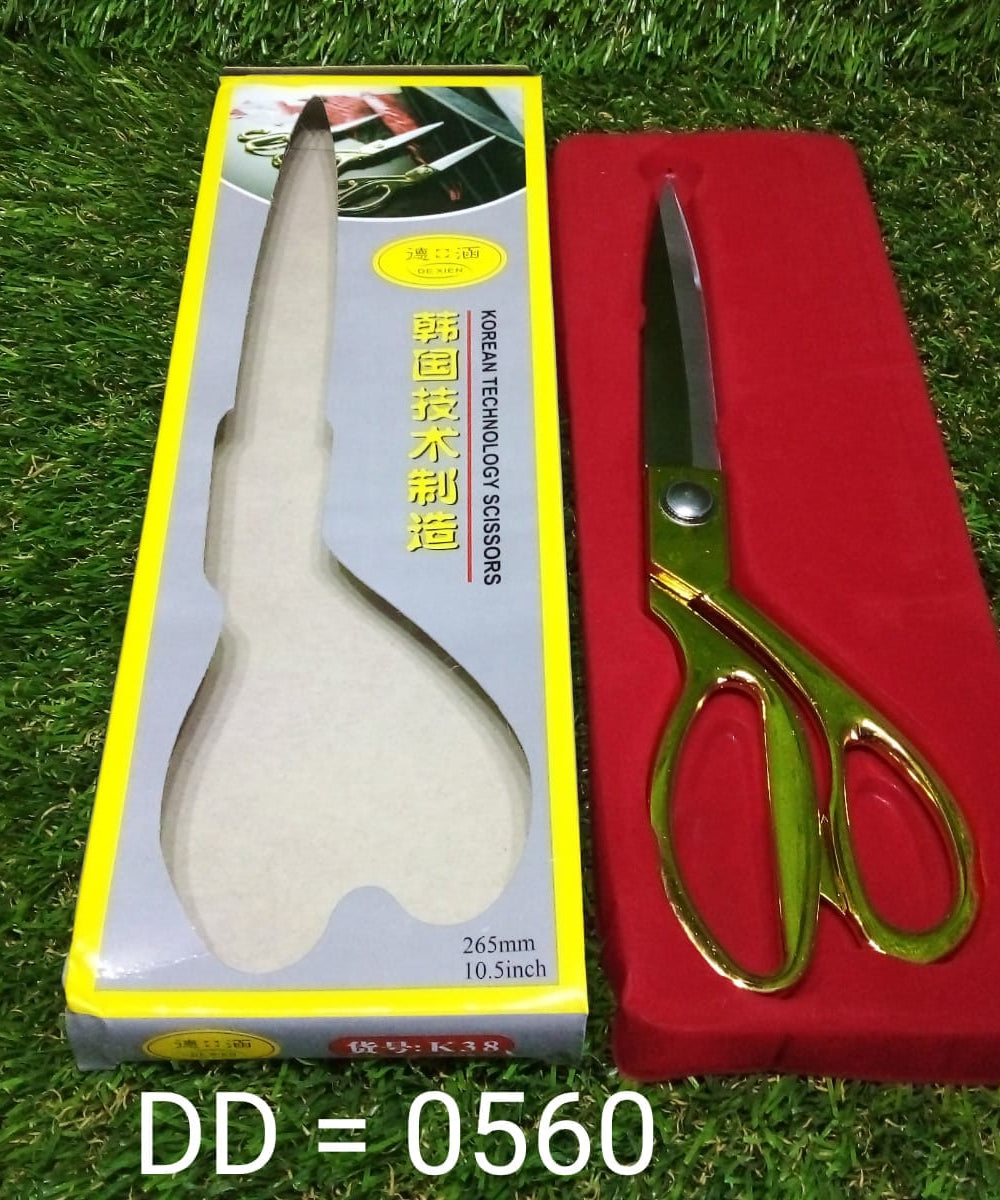 Sharp and stylish gold-plated scissors for fabric cutting.