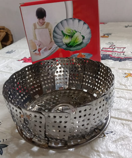 Stainless steel foldable basket for steaming and drying dishes.