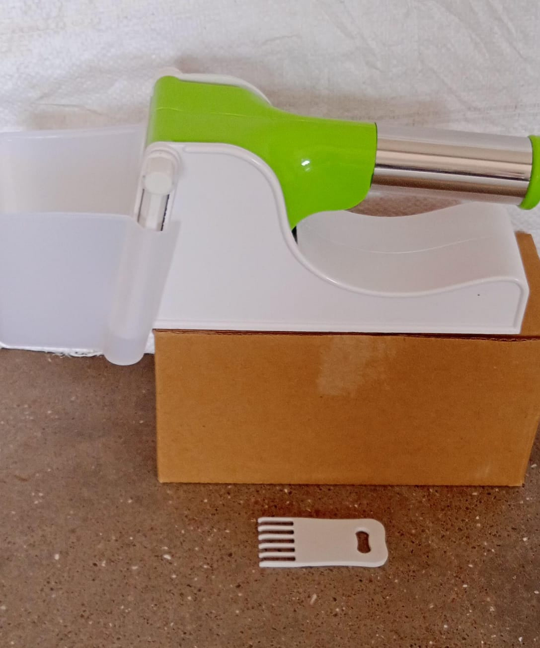 Plastic potato slicer with convenient container.