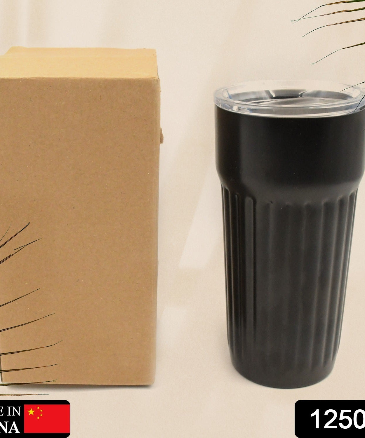 Vacuum insulated travel mug with lid for hot and cold drinks.