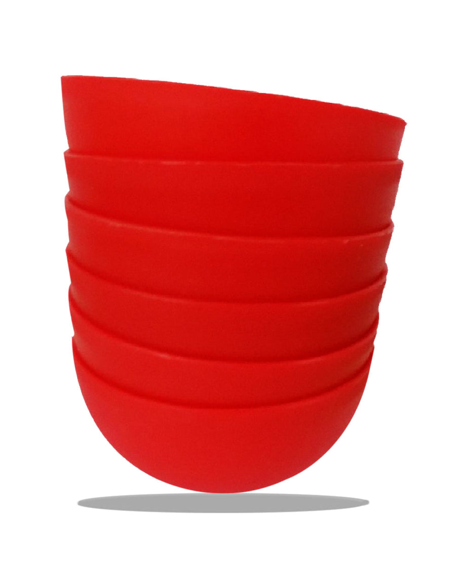 Soup bowl set displayed with spoons and saucers.