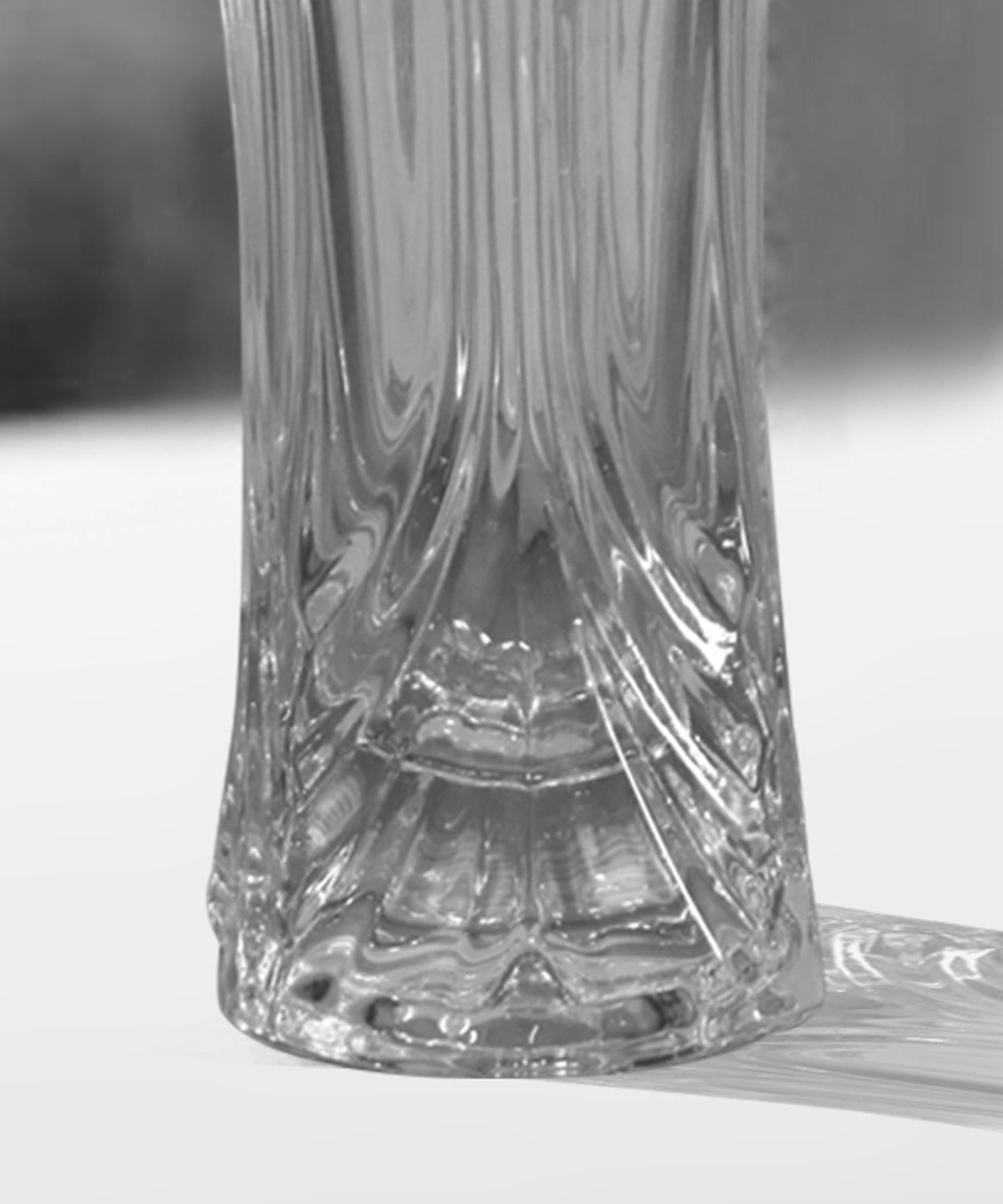 Sleek glass vase for displaying fresh flowers.