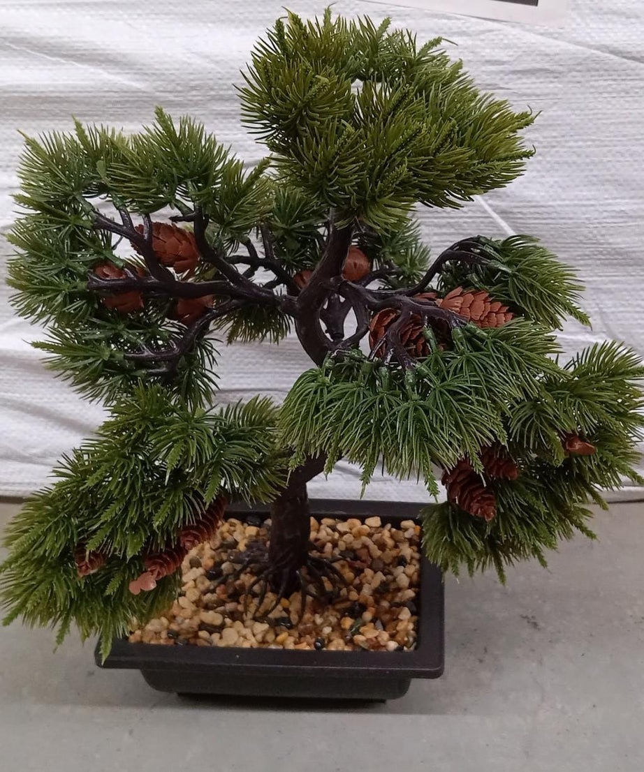 Artificial plant in a square pot with decorative look