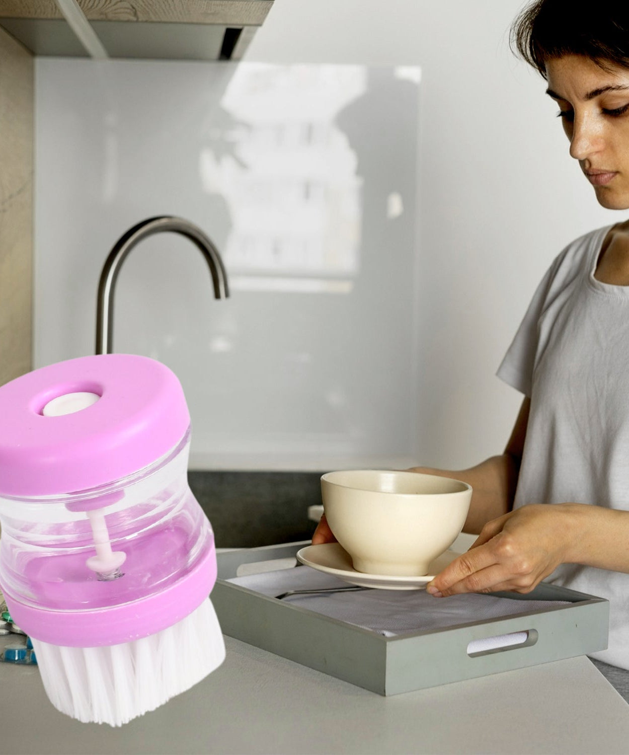 Multicolour wash basin brush with liquid soap dispenser.